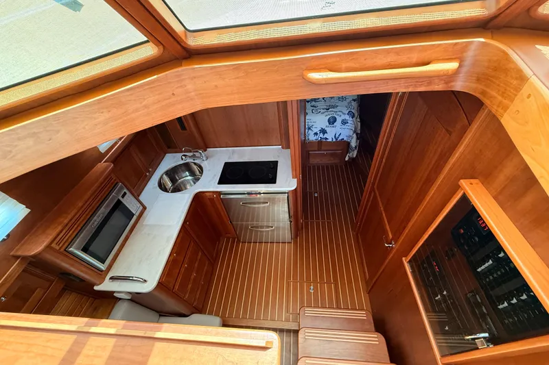 Slide: The Image of Interior of 2022 Sabre 38 Salon Express yacht, featuring a modern kitchen and cozy cabin. - 34
