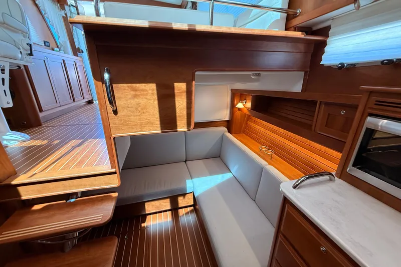 Slide: The Image of Interior of 2022 Sabre 38 Salon Express, featuring elegant wood finishes and cozy seating area. - 35