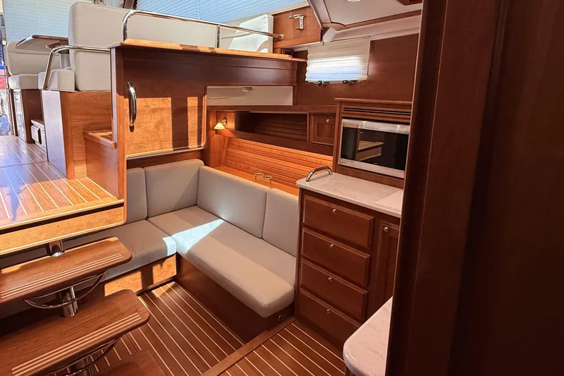 Slide: The Image of Luxurious interior of 2022 Sabre 38 Salon Express yacht with wood finish and seating area. - 36