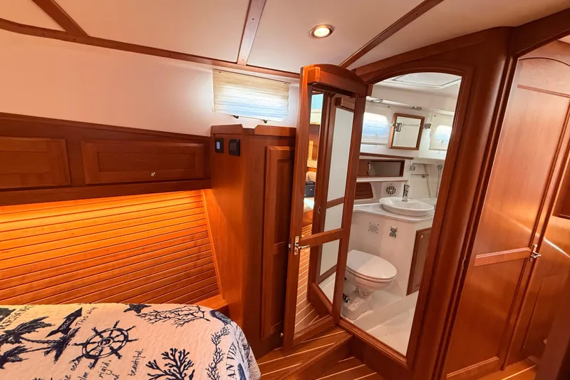 Slide: The Image of Luxurious 2022 Sabre 38 Salon Express interior with wooden finishes and modern bathroom. - 46