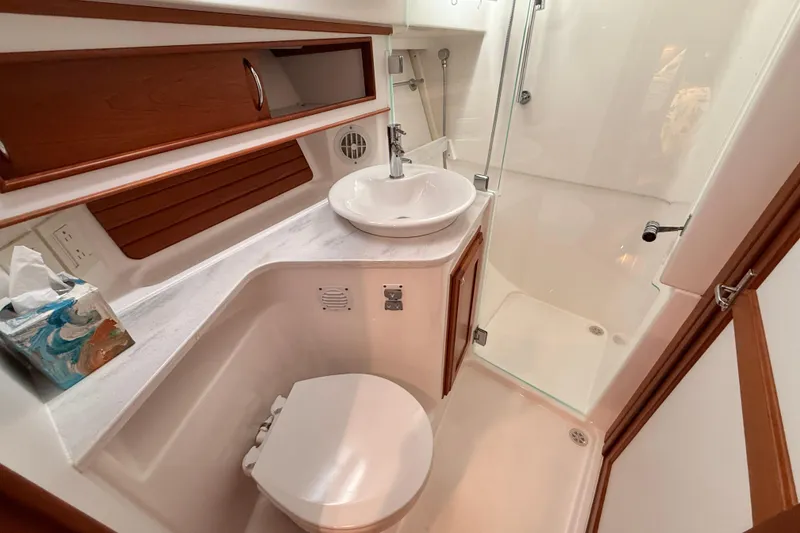 Slide: The Image of 2022 Sabre 38 Salon Express bathroom with modern fixtures and glass shower. - 48