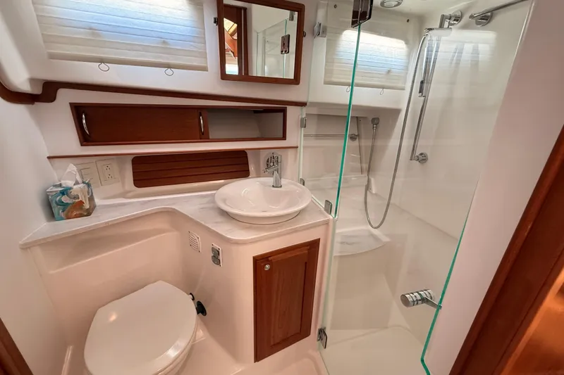 Slide: The Image of Luxurious bathroom in 2022 Sabre 38 Salon Express yacht with modern fixtures and glass shower. - 49