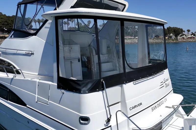 Slide: The Image of 2002 Carver 396 Motor Yacht docked in San Diego, featuring sleek design and spacious cabin. - 12