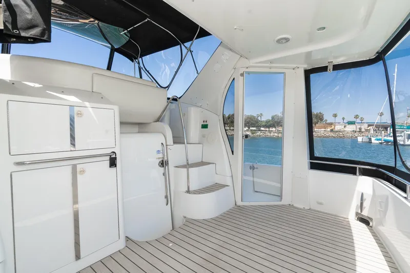 Slide: The Image of Interior view of 2002 Carver 396 Motor Yacht with sleek design and spacious deck. - 16