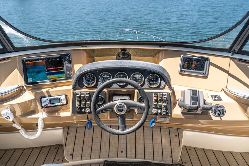 Slide: The Image of Helm of 2002 Carver 396 Motor Yacht with navigation instruments and steering wheel. - 20