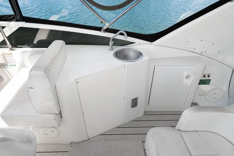 Slide: The Image of Interior of 2002 Carver 396 Motor Yacht with seating and sink area. - 22