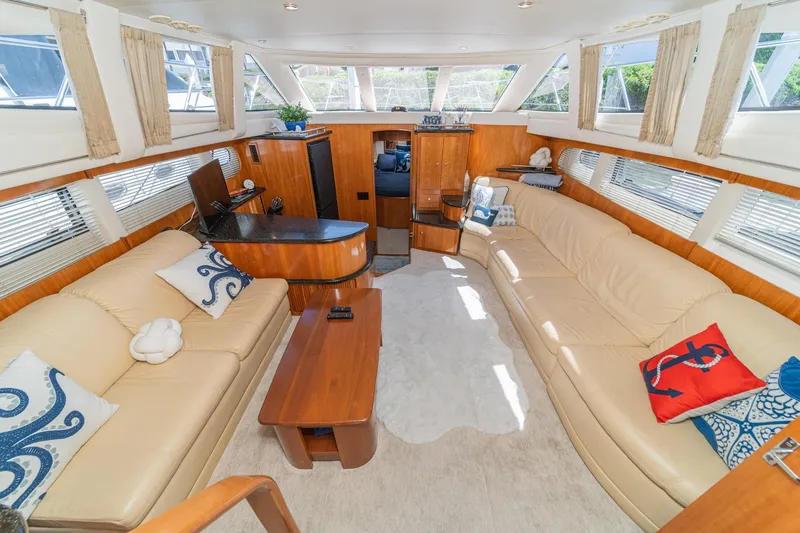 Slide: The Image of Luxurious interior of 2002 Carver 396 Motor Yacht with elegant seating and decor. - 23