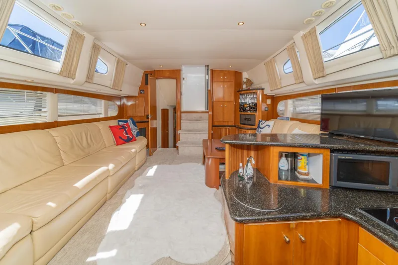 Slide: The Image of Luxurious interior of 2002 Carver 396 Motor Yacht with plush seating and modern amenities. - 24