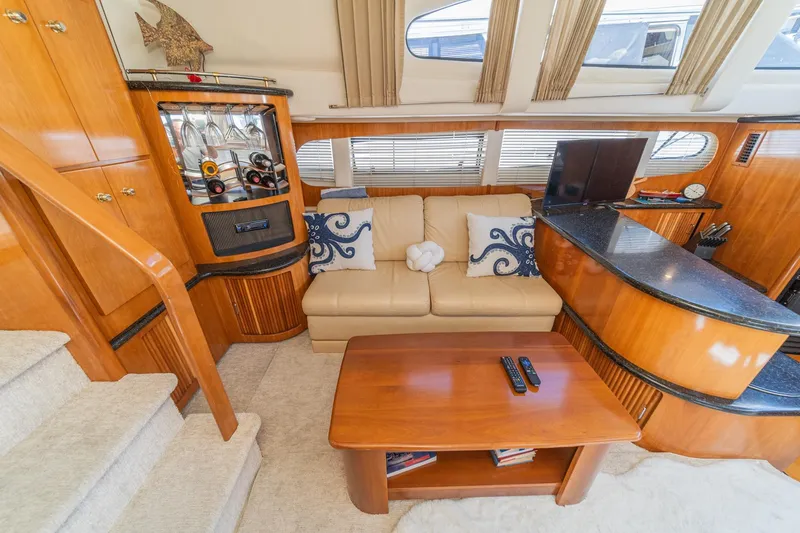 Slide: The Image of Luxurious interior of 2002 Carver 396 Motor Yacht with elegant seating and decor. - 25