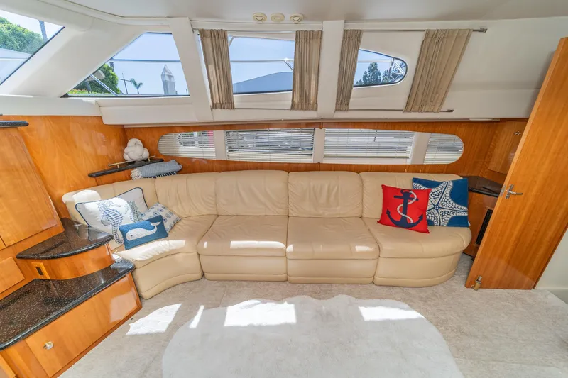 Slide: The Image of Luxurious interior of 2002 Carver 396 Motor Yacht with plush seating and nautical decor. - 26