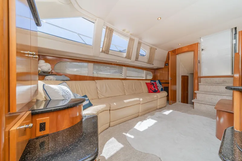 Slide: The Image of Luxurious interior of 2002 Carver 396 Motor Yacht with plush seating and elegant wood finishes. - 27