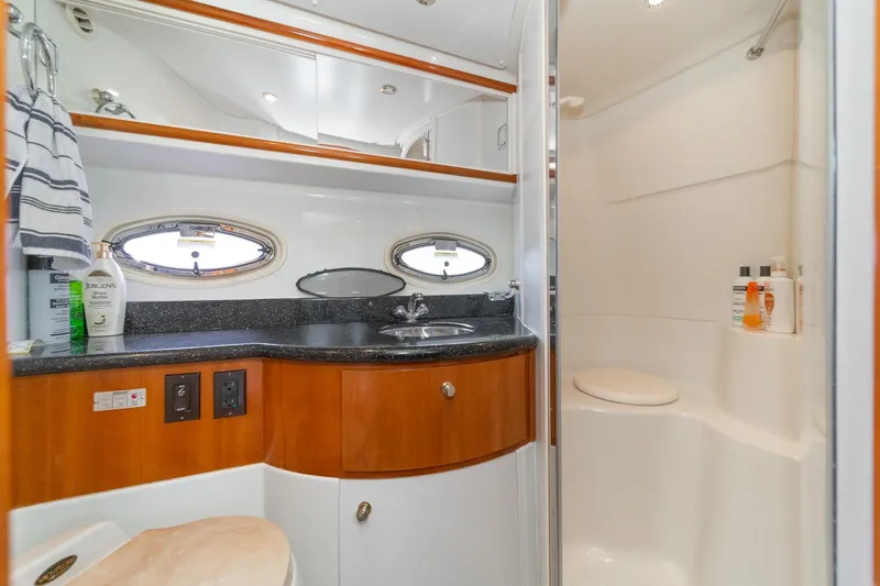 Slide: The Image of Luxurious bathroom in 2002 Carver 396 Motor Yacht with modern fixtures and elegant design. - 34