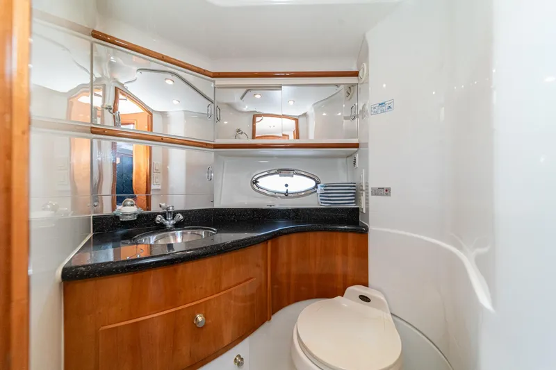 Slide: The Image of Luxurious bathroom in 2002 Carver 396 Motor Yacht with elegant wood cabinetry and modern fixtures. - 37