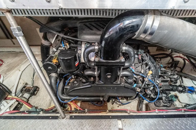 Slide: The Image of Engine compartment of a 2002 Carver 396 Motor Yacht, showcasing detailed mechanical components. - 41