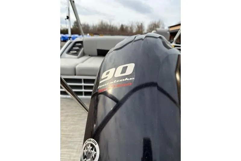 Slide: The Image of 2021 Bennington 22 SSBX boat with 90 horsepower four-stroke engine, close-up view. - 11