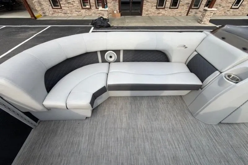 Slide: The Image of 2021 Bennington 22 SSBX boat interior with plush seating and modern design. - 15