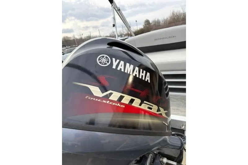 Slide: The Image of Yamaha VMAX four-stroke engine on 2021 Bennington 22 SSBX boat, cloudy sky background. - 17