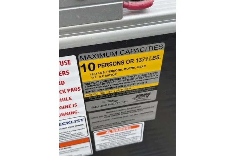 Slide: The Image of Capacity label on 2021 Bennington 22 SSBX boat, max 10 persons or 1371 lbs. - 9