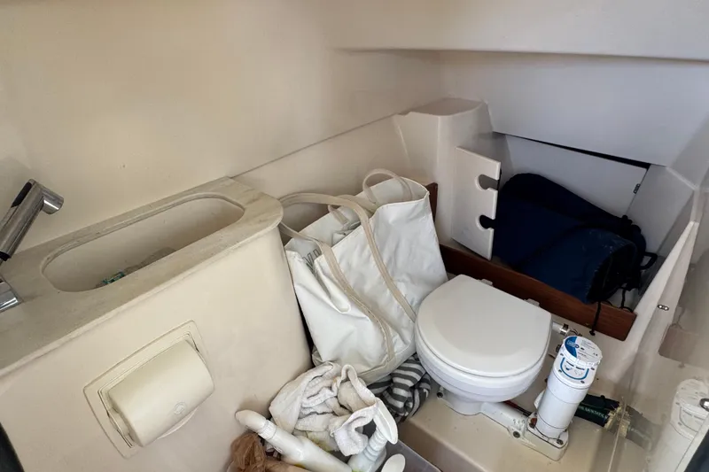 Slide: The Image of Twin outboard engines on a 2022 Grady-White Freedom 285 boat in clear water. - 19