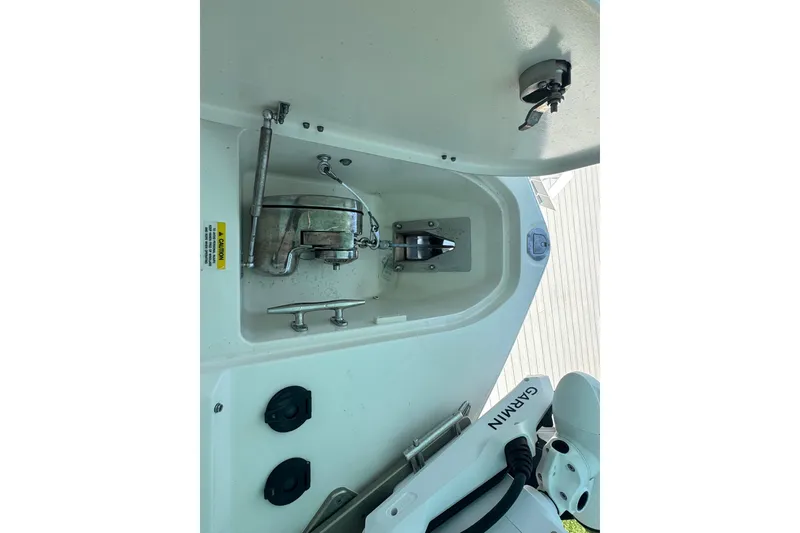 Slide: The Image of 2022 Grady-White Freedom 285 boat interior with seating and storage compartments. - 23