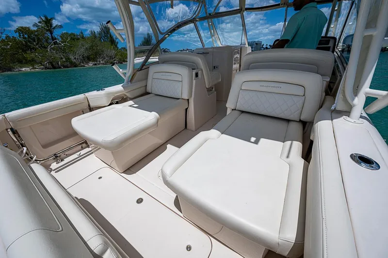 Slide: The Image of 2022 Grady-White Freedom 285 boat interior with luxurious seating and scenic water view. - 28