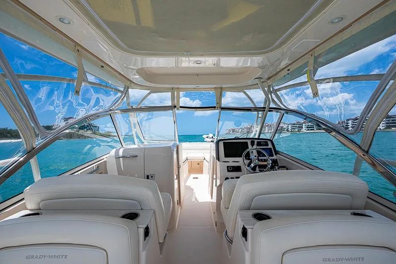 Slide: The Image of 2022 Grady-White Freedom 285 boat interior with ocean view and modern helm. - 29