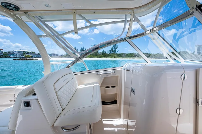 Slide: The Image of 2022 Grady-White Freedom 285 boat interior with luxurious seating and ocean view. - 30