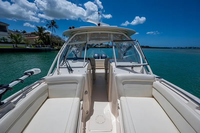 Slide: The Image of 2022 Grady-White Freedom 285 boat on clear blue water under a sunny sky. - 42