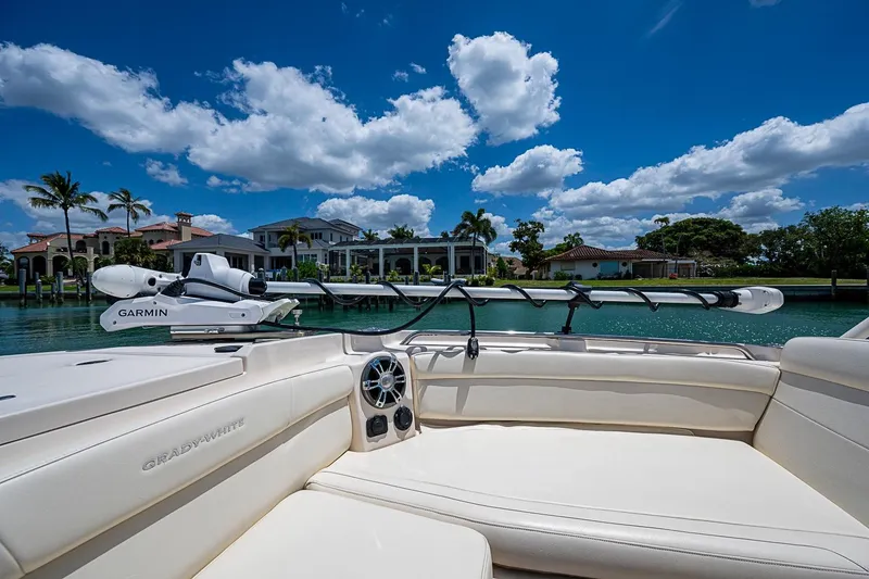 Slide: The Image of 2022 Grady-White Freedom 285 boat interior with waterfront view and clear blue sky. - 46