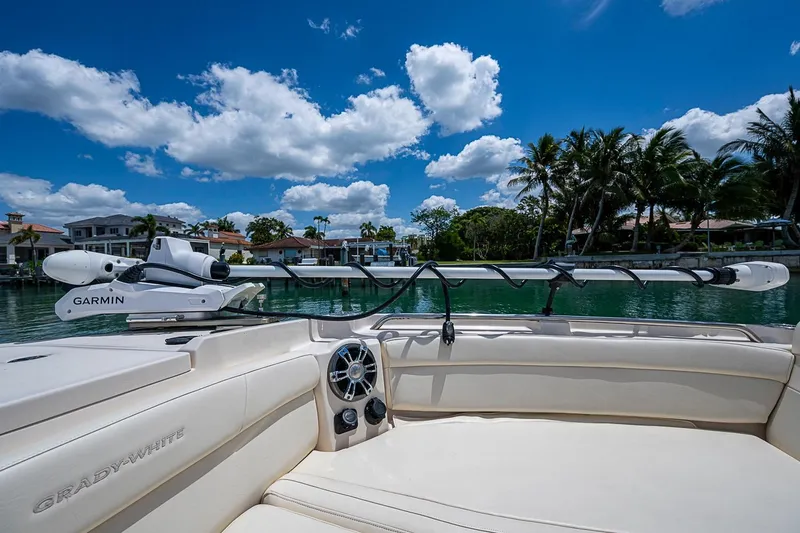 Slide: The Image of 2022 Grady-White Freedom 285 boat with Garmin equipment, docked near waterfront homes. - 47