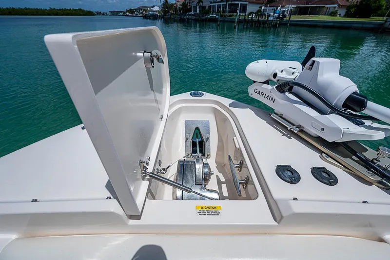 Slide: The Image of 2022 Grady-White Freedom 285 boat with open anchor hatch and Garmin equipment. - 48
