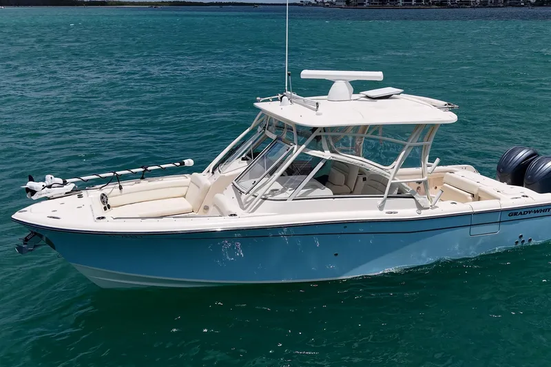 Slide: The Image of 2022 Grady-White Freedom 285 boat on clear blue water. - 55