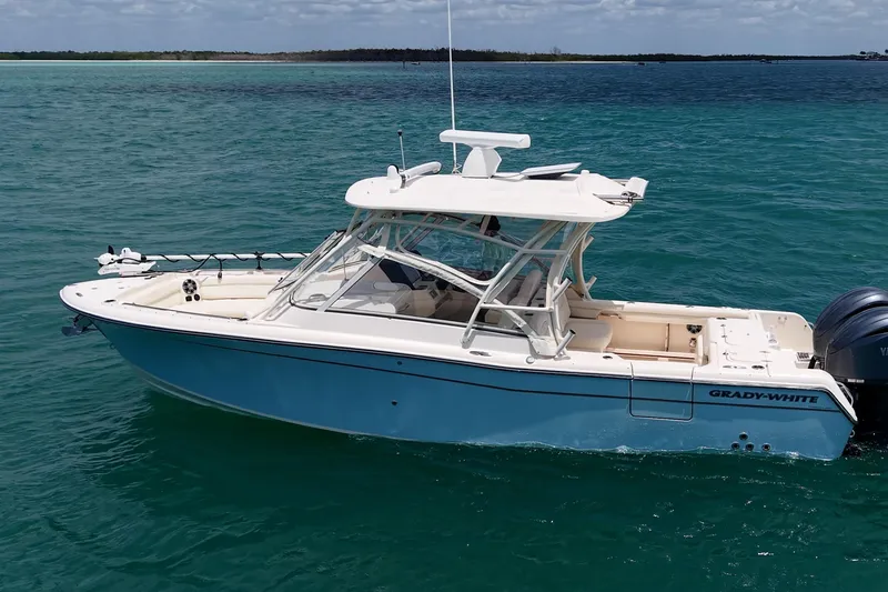 Slide: The Image of 2022 Grady-White Freedom 285 boat on clear blue water. - 56