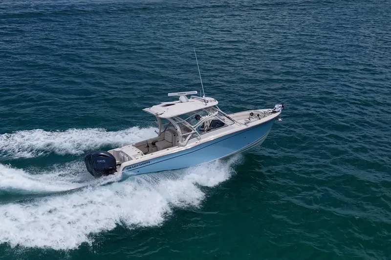 Slide: The Image of 2022 Grady-White Freedom 285 boat cruising on open water. - 65