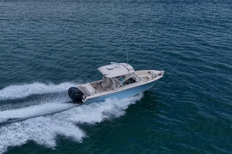 Slide: The Image of 2022 Grady-White Freedom 285 boat cruising on open water. - 67