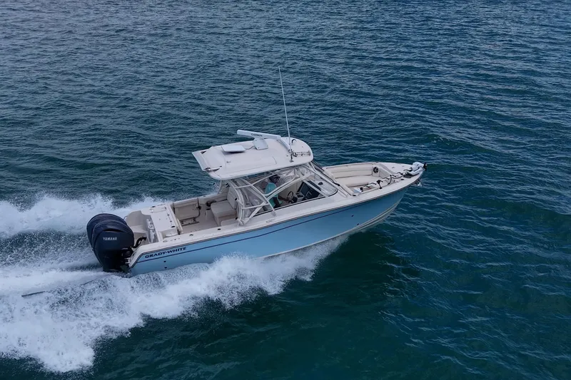 Slide: The Image of 2022 Grady-White Freedom 285 boat cruising on open water. - 69