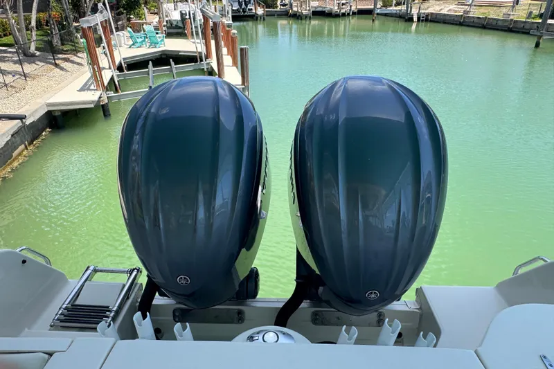 Slide: The Image of 2022 Grady-White Freedom 285 boat cruising on clear blue water. - 7