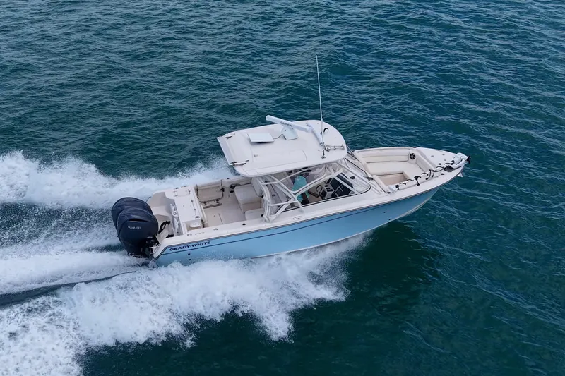 Slide: The Image of 2022 Grady-White Freedom 285 boat cruising on open water, showcasing sleek design and performance. - 70