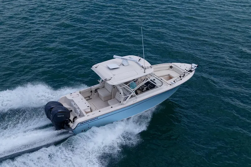 Slide: The Image of 2022 Grady-White Freedom 285 boat cruising on open water. - 71