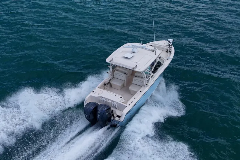 Slide: The Image of 2022 Grady-White Freedom 285 boat cruising on open water. - 73