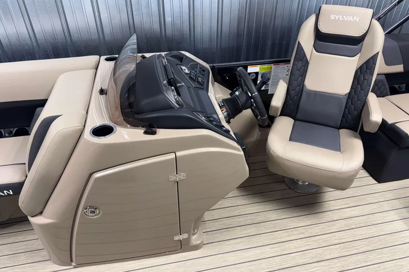 Slide: The Image of Captain's chair and console of 2026 Sylvan L1 LZ boat, featuring modern design. - 10