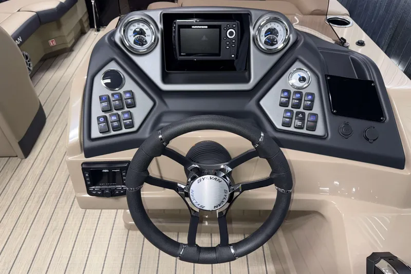 Slide: The Image of 2026 Sylvan L1 LZ boat dashboard with steering wheel and control panel. - 12