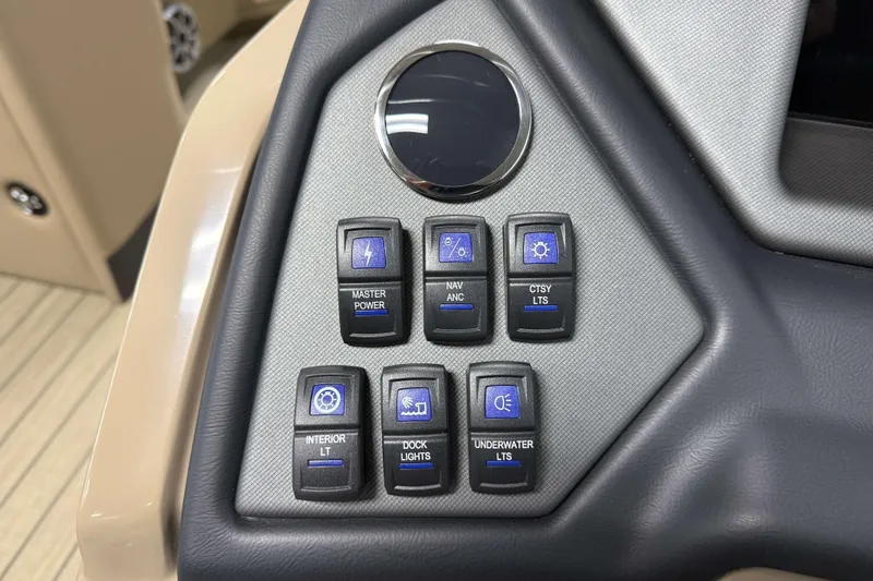 Slide: The Image of Control panel of 2026 Sylvan L1 LZ boat with various light switches. - 15