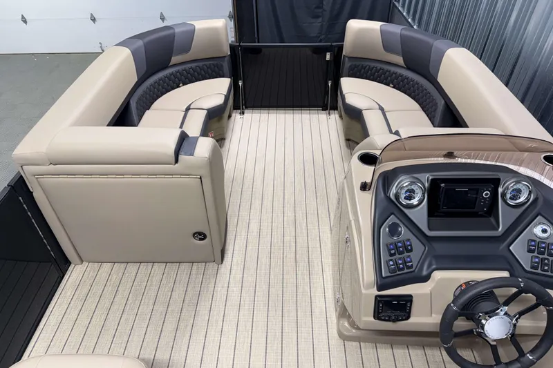 Slide: The Image of Luxurious 2026 Sylvan L1 LZ pontoon boat interior with plush seating and modern dashboard. - 18