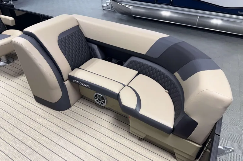 Slide: The Image of Luxurious seating on 2026 Sylvan L1 LZ pontoon boat, featuring stylish upholstery and integrated speaker. - 19