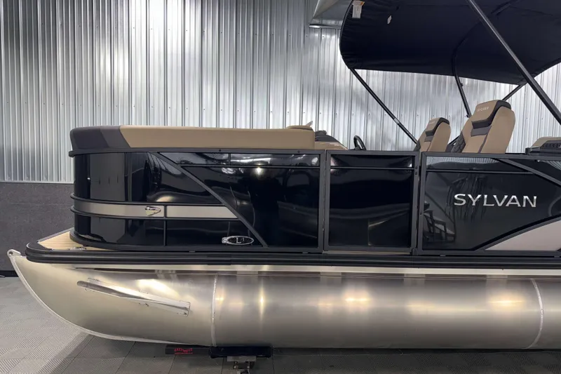Slide: The Image of 2026 Sylvan L1 LZ pontoon boat with sleek black design and comfortable seating. - 26