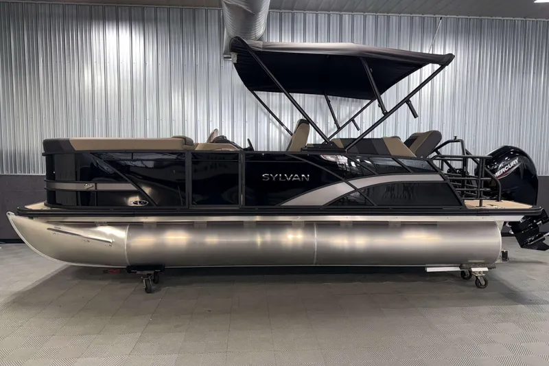Slide: The Image of 2026 Sylvan L1 LZ pontoon boat with canopy in a showroom setting. - 27