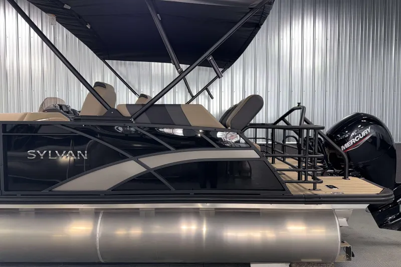 Slide: The Image of 2026 Sylvan L1 LZ pontoon boat with Mercury engine, sleek design, and comfortable seating. - 28