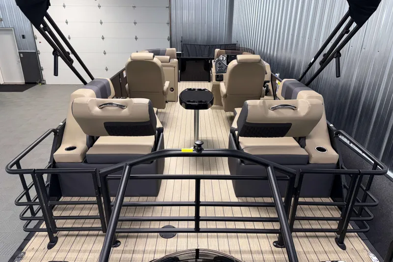 Slide: The Image of 2026 Sylvan L1 LZ pontoon boat interior with beige seating and modern design. - 3