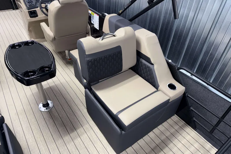 Slide: The Image of Interior of 2026 Sylvan L1 LZ boat with beige seating and black table. - 5